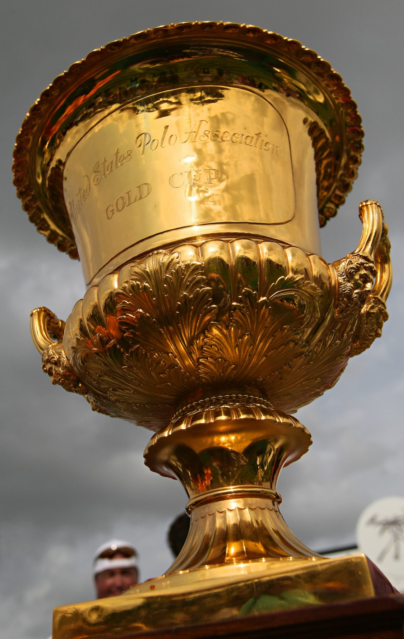 Large Gold Trophy Gleaming in Sun against a blue clear sky